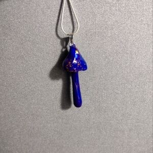 Marbled purple and blue mushrooms with golden flakes.